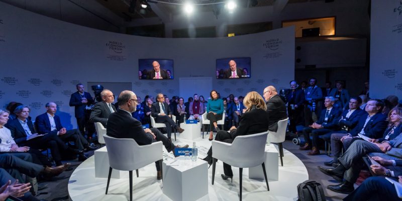 Group Of Corporate Heads Discussing In A Corporate Conference.